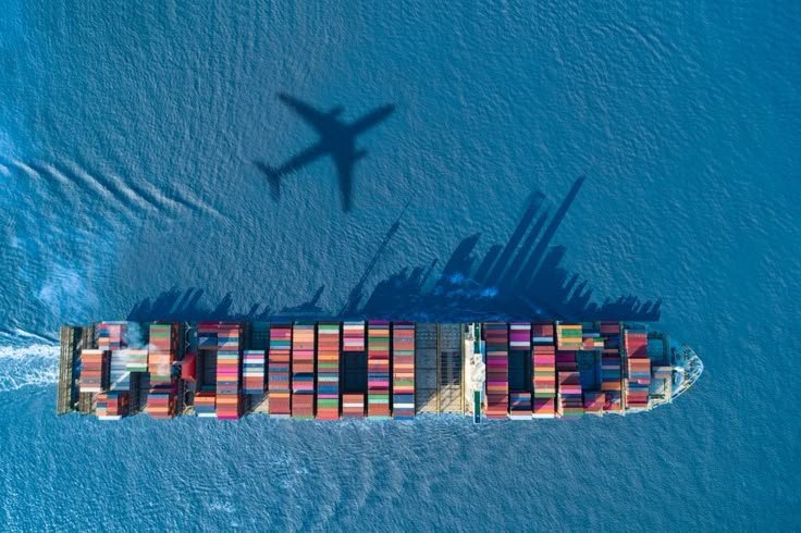 Container ship and cargo aircraft representing air and sea freight